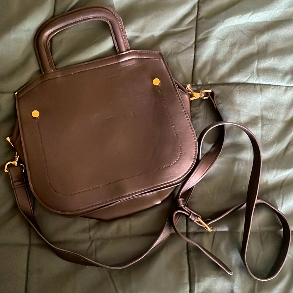 A New Day black small purse, gold detailings, small top handle.